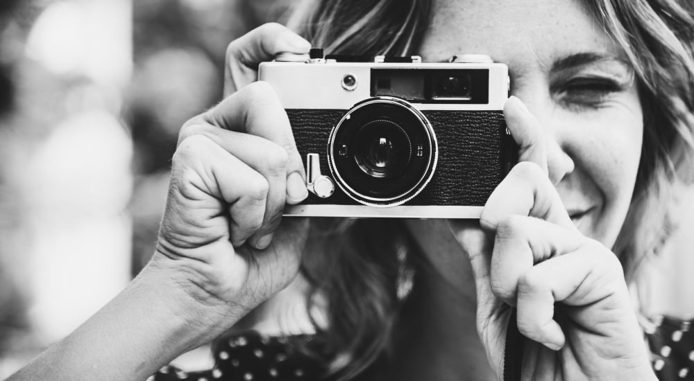 Woman talking picture with camera